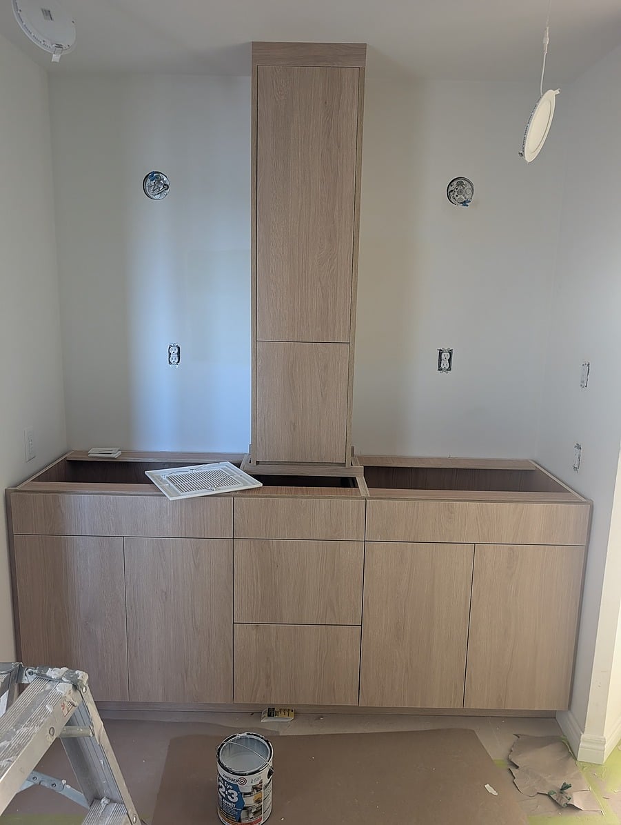 Modern natural wood bathroom cabinetry installed during a Visture renovation